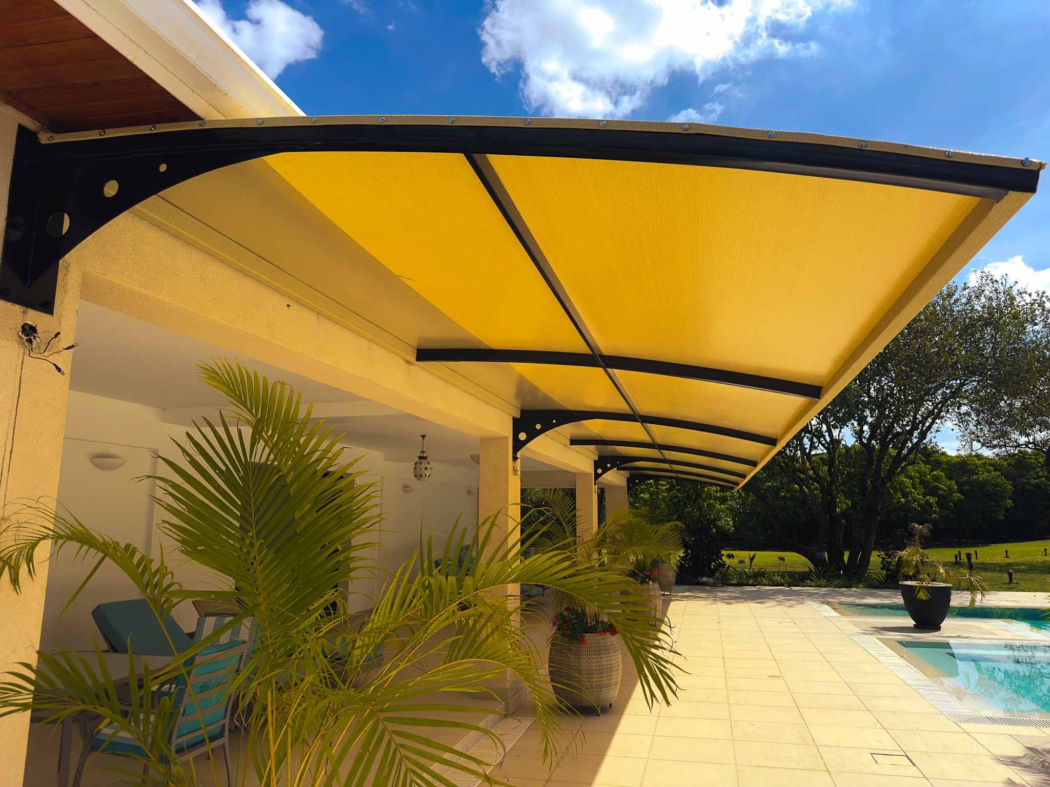 Cantilever carport over parked cars