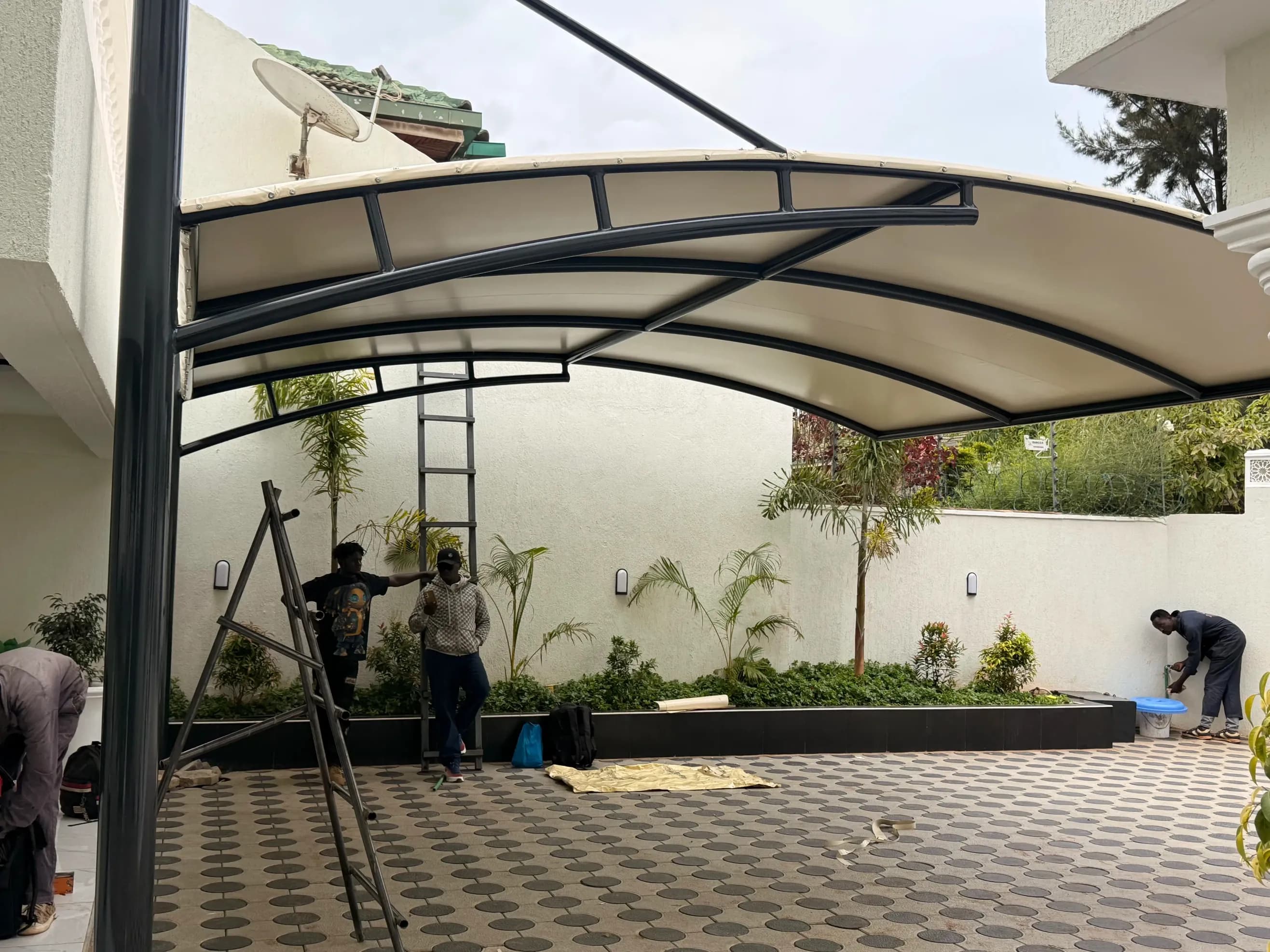Cantilever car parking shade installed over vehicles in Nairobi, Kenya
