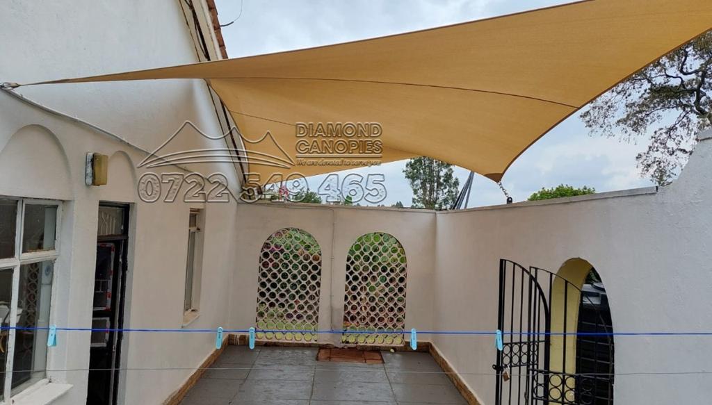 Shade sail installed without posts using wall-mount brackets in Kenya